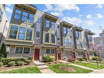 Modern townhome exterior with large windows, stylish trim, and well-maintained landscaping on a sunny day at 1617 Cannon View Ln, Charlotte, NC 28208