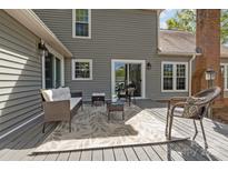 Inviting outdoor patio featuring comfortable seating, a stylish rug, and a relaxing ambiance perfect for entertaining at 2439 Heathershire Ln, Matthews, NC 28105