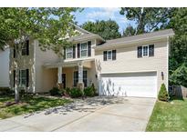 Charming two-story home featuring a well-manicured lawn and attached two-car garage at 3009 Early Rise Ave, Indian Trail, NC 28079
