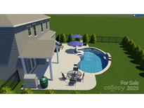 Inviting backyard with a stunning pool, patio seating, and lush landscaping perfect for outdoor relaxation and entertainment at 704 Fresia Dr, Tega Cay, SC 29708