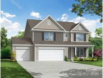 Charming two-story home featuring a three-car garage, neutral siding, and a well-manicured lawn at 2252 Tabor Rd # 575, Sherrills Ford, NC 28673