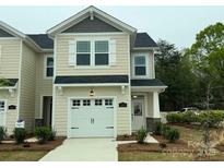 Charming two-story home with a one car garage and landscaped front yard at 248 Laura Elizabeth Ln, Clover, SC 29710
