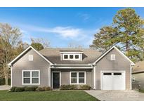 Charming single-Gathering home featuring a grey exterior, well-manicured lawn, and an attached one-car garage at 3708 Small Ave, Charlotte, NC 28269