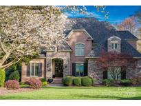 Charming brick home with beautiful stone accents and lush landscaping at 4628 Sierra View Dr, Denver, NC 28037