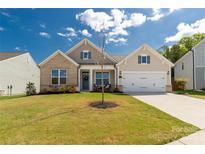 Charming single-Gathering home featuring a brick and siding facade with a manicured lawn at 5119 Moselle Ave, Fort Mill, SC 29707
