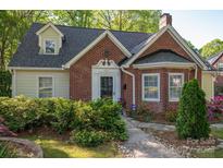 Charming brick home featuring a well-manicured front yard and inviting entrance at 1220 Oakwood Ave, Gastonia, NC 28052