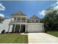 Charming two-story home with a covered porch, attached two-car garage and a well maintained lawn at 5100 Verona Rd # 96, Charlotte, NC 28213