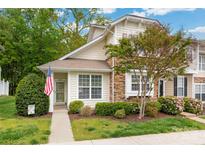 Charming home featuring stone accents, a manicured lawn, and a welcoming front entrance at 969 Copperstone Ln, Fort Mill, SC 29708