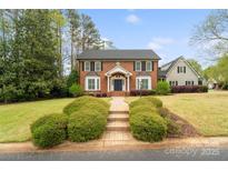 Charming brick home with a manicured front yard and a welcoming walkway, offering classic curb appeal at 1736 Cavendale Dr, Rock Hill, SC 29732