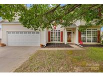 Well-maintained two-story home with attached garage and neat landscaping at 5519 Burning Ridge Dr, Monroe, NC 28110