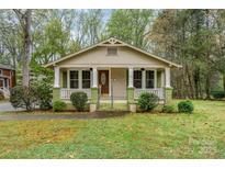 Charming bungalow with inviting front porch, manicured landscaping, and lots of curb appeal at 119 E End Ave, Statesville, NC 28677