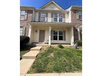 Charming townhome with a welcoming porch and well-maintained front yard at 2006 Cramerton Village Dr # 31-D, Cramerton, NC 28032