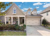 Charming home with a manicured front yard, covered porch, and inviting curb appeal at 2021 Pinyon Ln, Lancaster, SC 29720