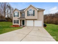 Charming two-story home featuring a two-car garage and well-maintained landscaping at 240 Bluffton Rd, Mooresville, NC 28115