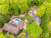 Expansive property with a swimming pool, lush landscaping, and a detached garage surrounded by mature trees at 2470 Highway 557 Rd, Clover, SC 29710