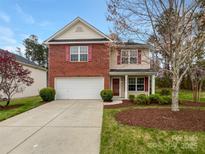 Charming two-story home featuring a brick facade and attached two-car garage at 2218 Verde Creek Rd, Charlotte, NC 28214