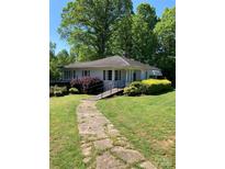 Charming single-story home with landscaped front yard and concrete walkway to the front entrance at 311 33Rd Street Se Dr, Hickory, NC 28602