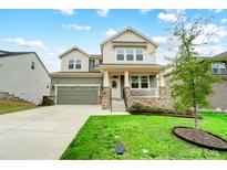 Charming two-story home featuring a well-manicured lawn, attached garage, and inviting front porch at 10161 Castlebrooke Dr, Concord, NC 28027