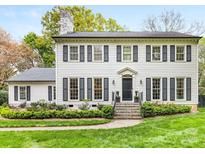 Charming two-story home with well-manicured lawn and classic architectural details at 2912 Wheelock Rd, Charlotte, NC 28211
