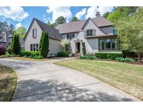 Stately home featuring manicured landscaping, a circular driveway, and a timeless facade at 3160 Ashwood Park Dr, Belmont, NC 28012