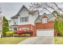 Charming two-story home featuring brick accents, a two-car garage, and well-maintained landscaping at 3383 Norwich Rd, Fort Mill, SC 29715