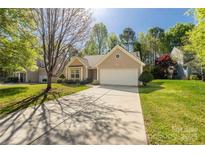 Charming single-story home with a well-maintained lawn and a two-car garage at 3411 Xandra Ct, Indian Land, SC 29707