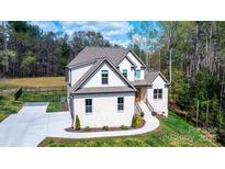Beautiful brick home with a well-manicured lawn and professional landscaping at 112 Whitman Ct # 275, Taylorsville, NC 28681