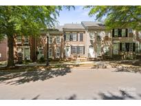 Charming brick townhomes featuring well-maintained landscaping and classic architectural details at 164 Singleton Rd, Mooresville, NC 28117