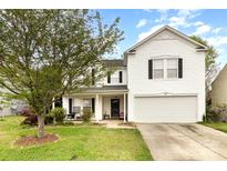 Charming two-story home with white siding, black shutters, and a well-maintained front yard at 3254 Pikes Peak Dr, Gastonia, NC 28052