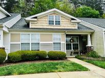 Inviting townhome featuring traditional architecture, well-manicured landscaping, and charming front porch at 413 Lexie Ln # 92, Rock Hill, SC 29732