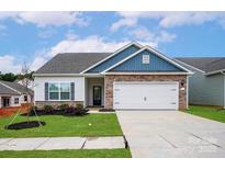 Charming single-Gathering home with stone accents, a two-car garage, and well-maintained landscaping at 5711 Skinny Down, Charlotte, NC 28215