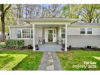 Charming home with a brick facade, covered porch, and landscaped front yard creates welcoming curb appeal at 751 & 767 Pettit Rd, Catawba, SC 29704