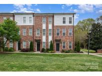 Attractive brick townhome with manicured lawn and landscaping at 791 Seigle Point Dr, Charlotte, NC 28204