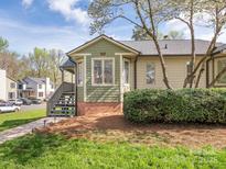 Charming home featuring a bay window, green accents, and well-maintained landscaping at 1022 Kenilworth Nw Ct, Concord, NC 28027