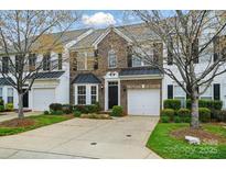 Charming brick townhome with a well-manicured lawn and attached one-car garage at 125 Snead Rd # 60, Fort Mill, SC 29715
