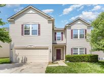 Charming two-story home features a two-car garage, landscaped yard, and inviting entrance at 3882 Shasta Cir, Clover, SC 29710