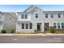 Charming two-story townhome with a mix of traditional and modern design elements, nestled in a friendly neighborhood at 562 Amalfi Dr, Davidson, NC 28036