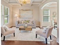 Inviting living room features stylish furniture, coffered ceilings, and elegant decor for comfortable living at 9069 Blue Ridge Dr, Indian Land, SC 29707