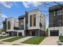 Modern townhomes showcase contemporary architecture and private driveways at 215 Keswick Ave, Charlotte, NC 28206