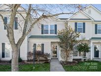 Charming two-story townhouse with well-maintained landscaping and a welcoming entrance at 4211 Center Place Dr, Harrisburg, NC 28075
