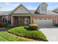 Charming brick home featuring a two-car garage and well-manicured front lawn at 489 26Th Ne Ave # C, Hickory, NC 28601