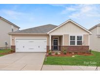 Charming single story home with a two car garage and well manicured yard at 1125 Hallman Branch Ln, Lincolnton, NC 28092
