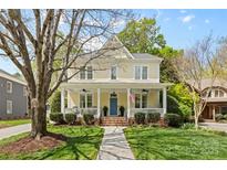 Charming two-story home featuring a welcoming front porch and a beautifully landscaped front yard at 2569 Lower Assembly Dr, Fort Mill, SC 29708