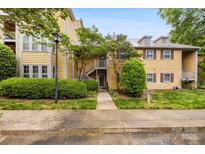 Charming two-story condo in a residential neighborhood with mature landscaping and a welcoming entryway at 3224 Selwyn Farms Ln # 3, Charlotte, NC 28209