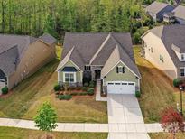Charming home with a well-maintained lawn, tidy landscaping, and a two-car garage at 4989 Samoa Ridge Dr, Lancaster, SC 29720