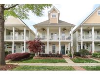 Charming two-story home with double porches, manicured landscaping, and inviting curb appeal at 5121 Alysheba Dr, Indian Trail, NC 28079