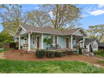 Charming bungalow with inviting front porch and well-manicured landscaping at 1801 Wilmore Dr, Charlotte, NC 28203