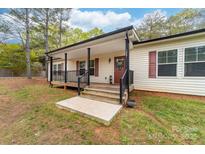 Inviting front porch with black railings and room for seating at 1957 Beth Haven Church Rd, Denver, NC 28037