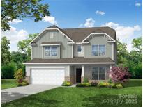 Charming two-story home boasts manicured lawn, attached two-car garage, and Craftsman-style architectural details at 2017 Embassy Ct # 51, Charlotte, NC 28213