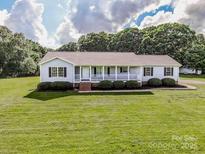 Charming ranch-style home with well-manicured lawn and inviting front porch at 2811 Saint James Church Rd, Denver, NC 28037